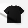 Minimal flat lay of a plain black t-shirt on a white background